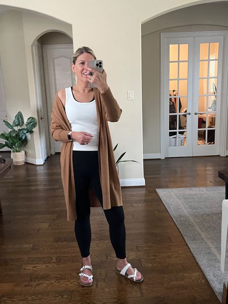 Weekend athleisure wear is here! Long open front cardigan in camel. Runs oversized.  But I’m wearing a medium.  Ribbed tank top runs fitted. Black leggings with pockets. Leggings run tts. Look alike slides.  Also linked some great Amazon options too! 

#LTKfitness #LTKfindsunder50 #LTKover40