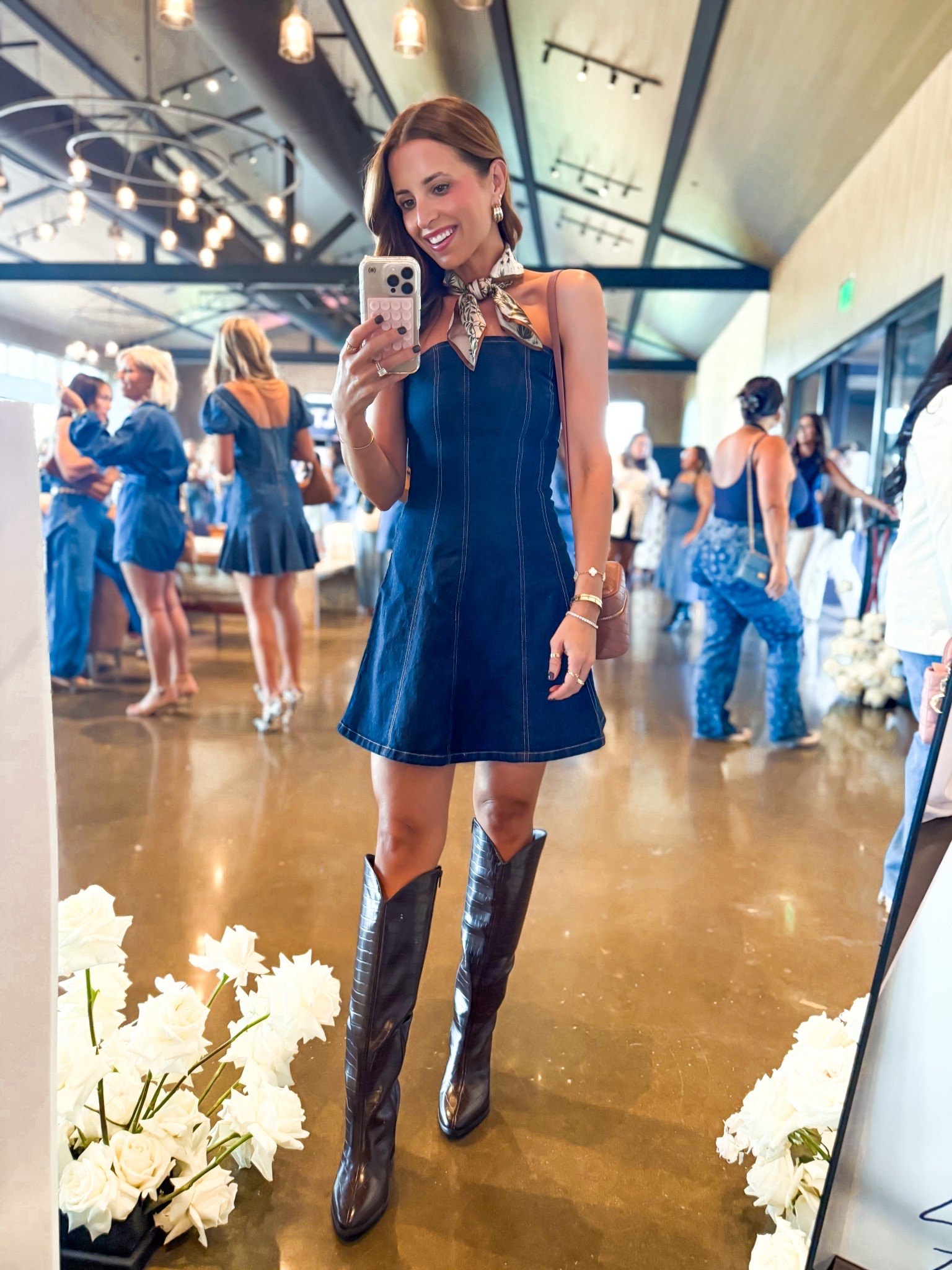 Country concert outfit. Fall outfit. Party outfit. Abercrombie Mila denim dress in XS reg - I sized up because the band is snug. Preferred regular length over petite (a smidge too short on me). Target chocolate brown knee high boots are TTS. YSL vanity bag in barely pink. 

#LTKParties #LTKCon #LTKShoeCrush