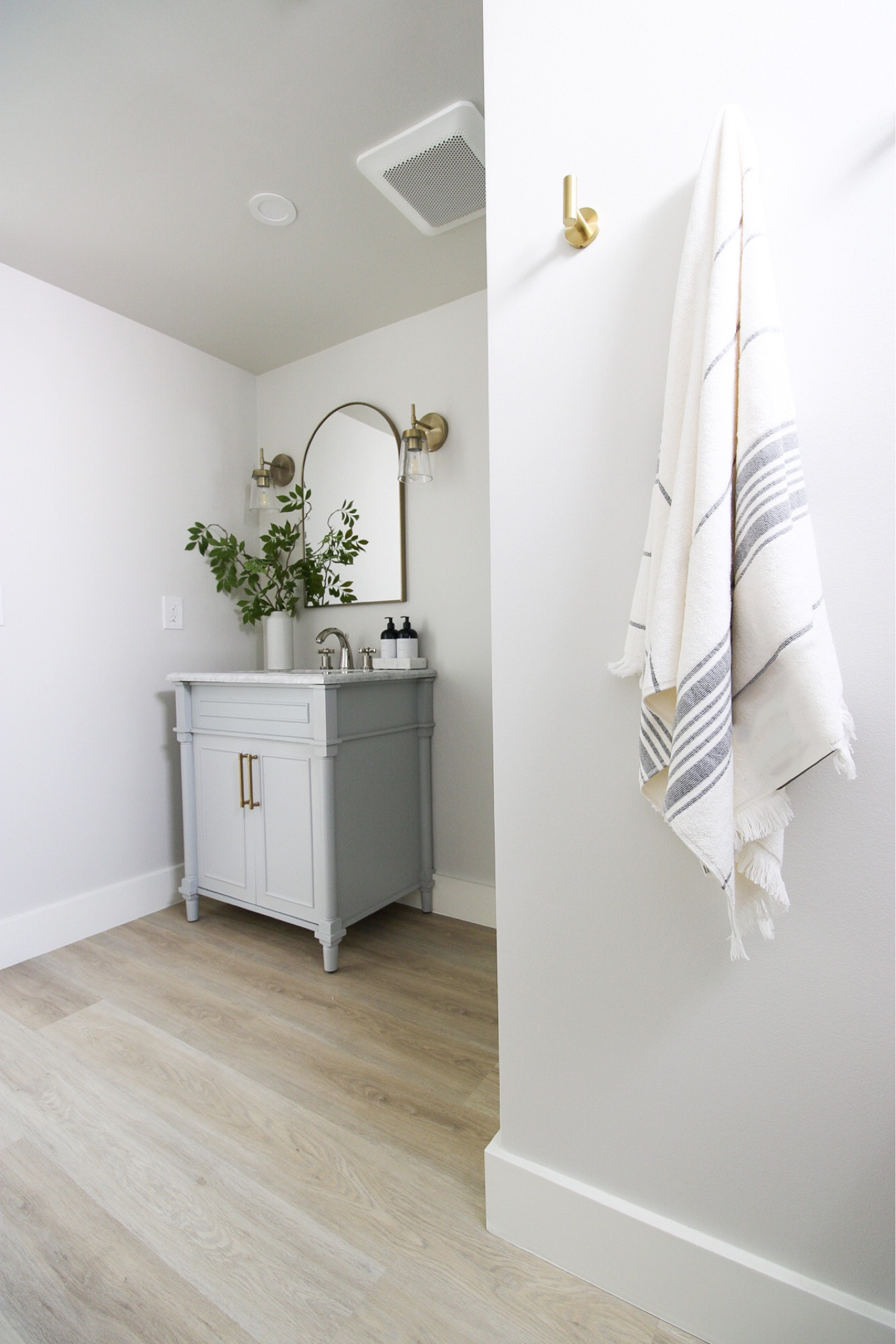 Basement bathroom decor, grey vanity, brass sconces 

#LTKhome #LTKfindsunder100 #LTKstyletip