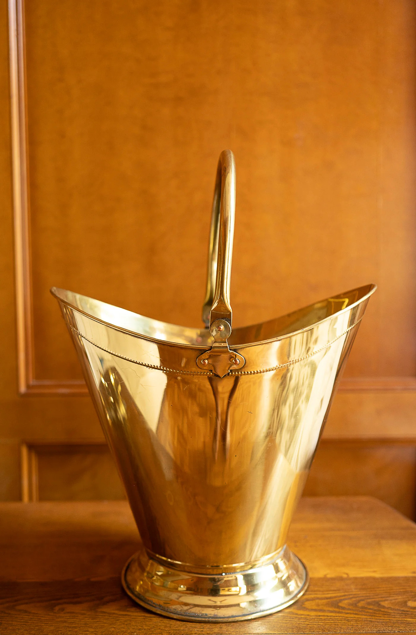 Antique Brass Helmet Shaped Coal Bucket With Brass Handle Raised On A | Sweenshots Studios