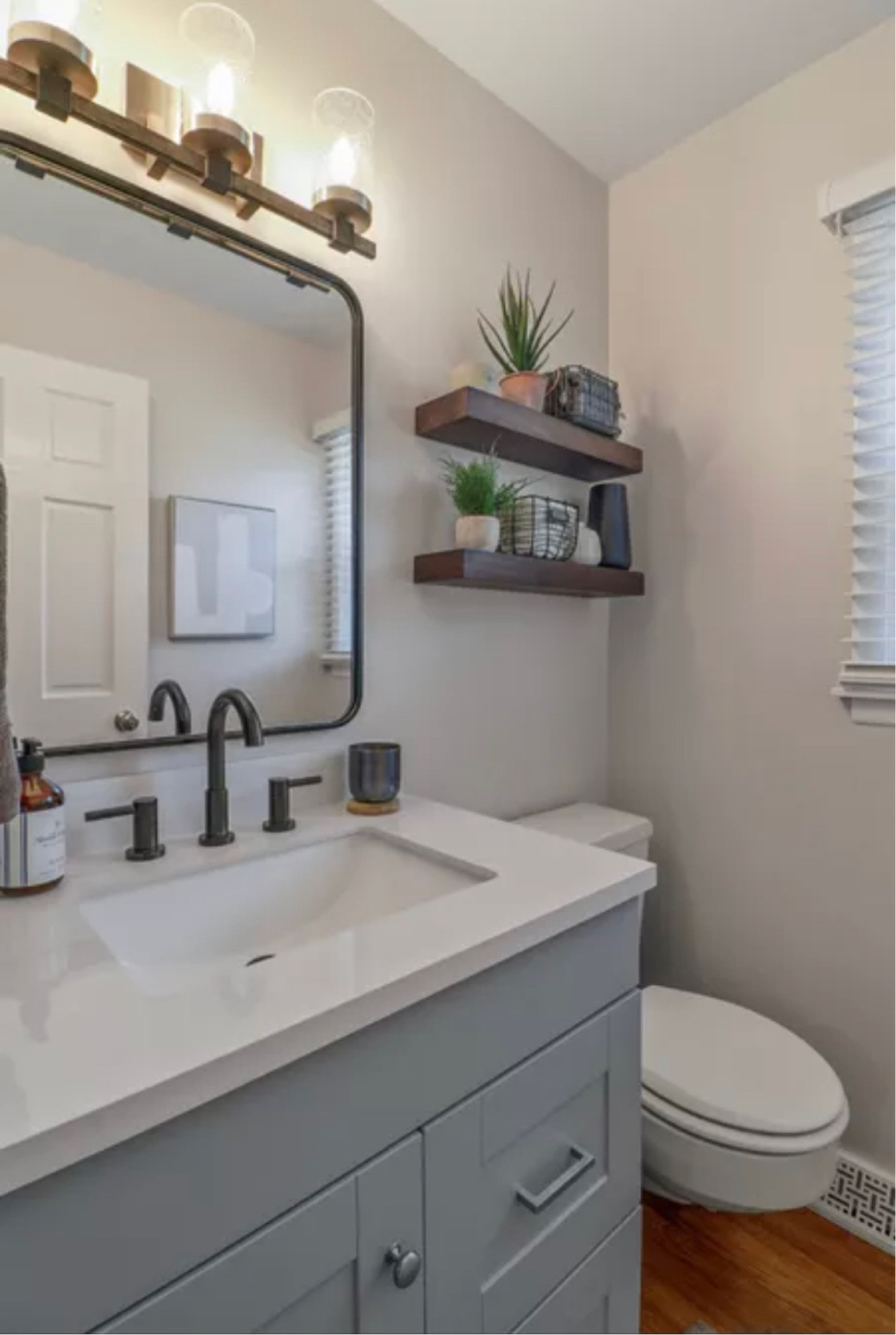 bathroom, shelf, plant, towel, wire basket, aloe plant, shelf styling, vanity, light, mirror, wall art, abstract art, candle, delta faucet

#LTKhome #LTKstyletip