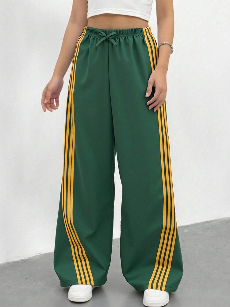 Sparklyn Tween Girl Wide-Legged Long Pants - With Yellow Stripes In Dark Green, Featuring A Belt With Drawstring And Bow Decoration. Comfortable And Loose-Fitting, Suitable For Older Children. The Side Stripe Design Makes These Casual And Fashionable Long Pants. The Fabric Is Comfortable, Making Them A Choice For Girls' Daily Wear. | SHEIN