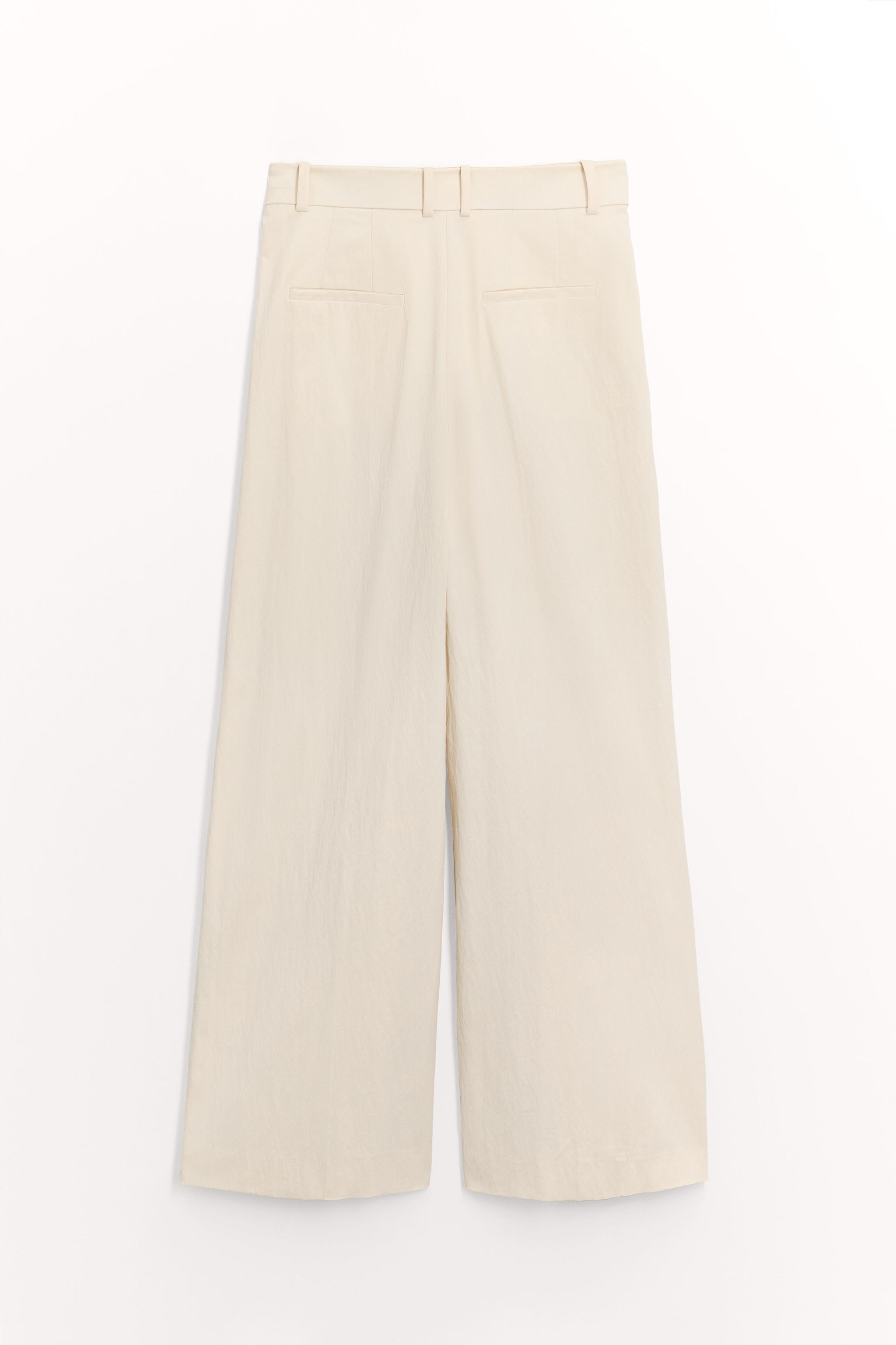 ZARA WOMAN COLLECTIONPants made of cotton yarn. Mid-rise waist with belt loops. Side pockets and ... | Zara US