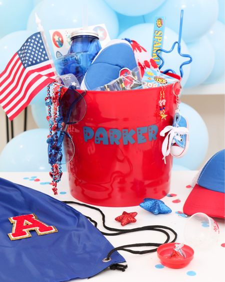 Patriotic Kids Gift “bucket”! Filled with patriotic wearables for parties & parades! Use the personalized bucket for storage or play! 
#patrioticgifts #kidspatriotic #4thjuly 

#LTKKids #LTKGiftGuide #LTKSeasonal