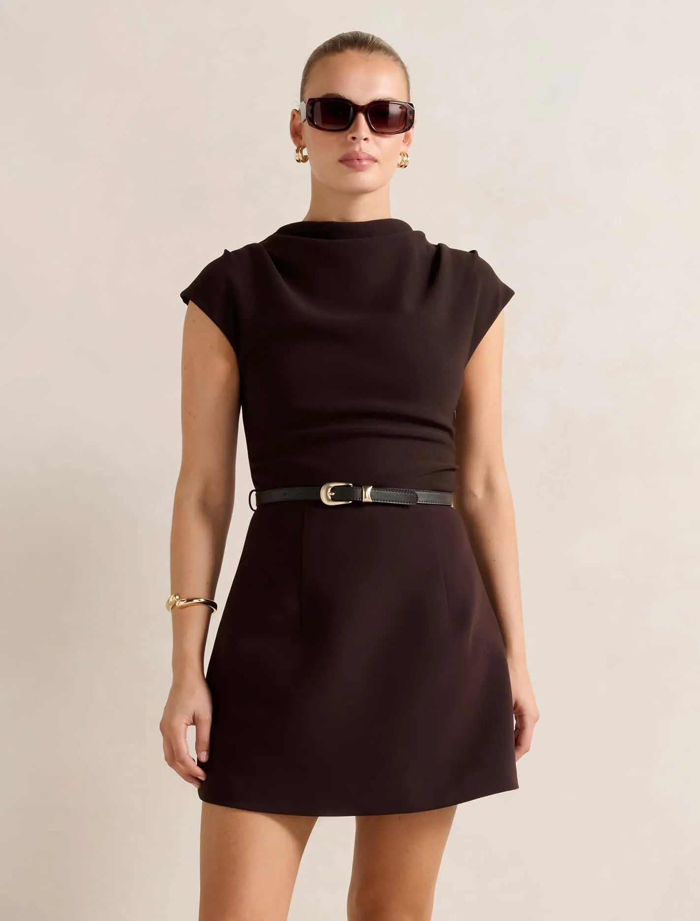 Natalie 2-In-1 Mini Dress
Add to Wish List
As low as $149.99
ColourChocolate
Size (US)
02468101214
ADD TO BAG
FIND IN STORE
You are away from free shipping
DESIGNER NOTES
An effortlessly polished mini dress perfect for workdays, dinner dates or evening drinks

Front body length: 81cm (Size 8)
Regular fit
Smooth knit fabrication
High neckline
Sleeveless design
2-in-1 design
A-line mini skirt
Comes with a sleek faux leather belt
Zip closure
Lined
Minimum 50% Recycled Polyester
This garment contains recycled polyester, which reuses existing plastic material. This reduces reliance on virgin materials. Read more here.

DETAILS
MODEL SIZING
SHIPPING AND RETURNS
 | Ever New (CA)