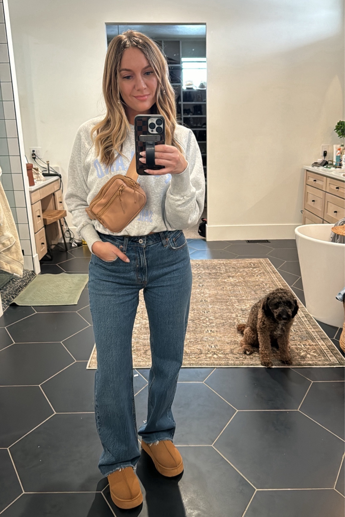 Wearing the dark wash raw hem