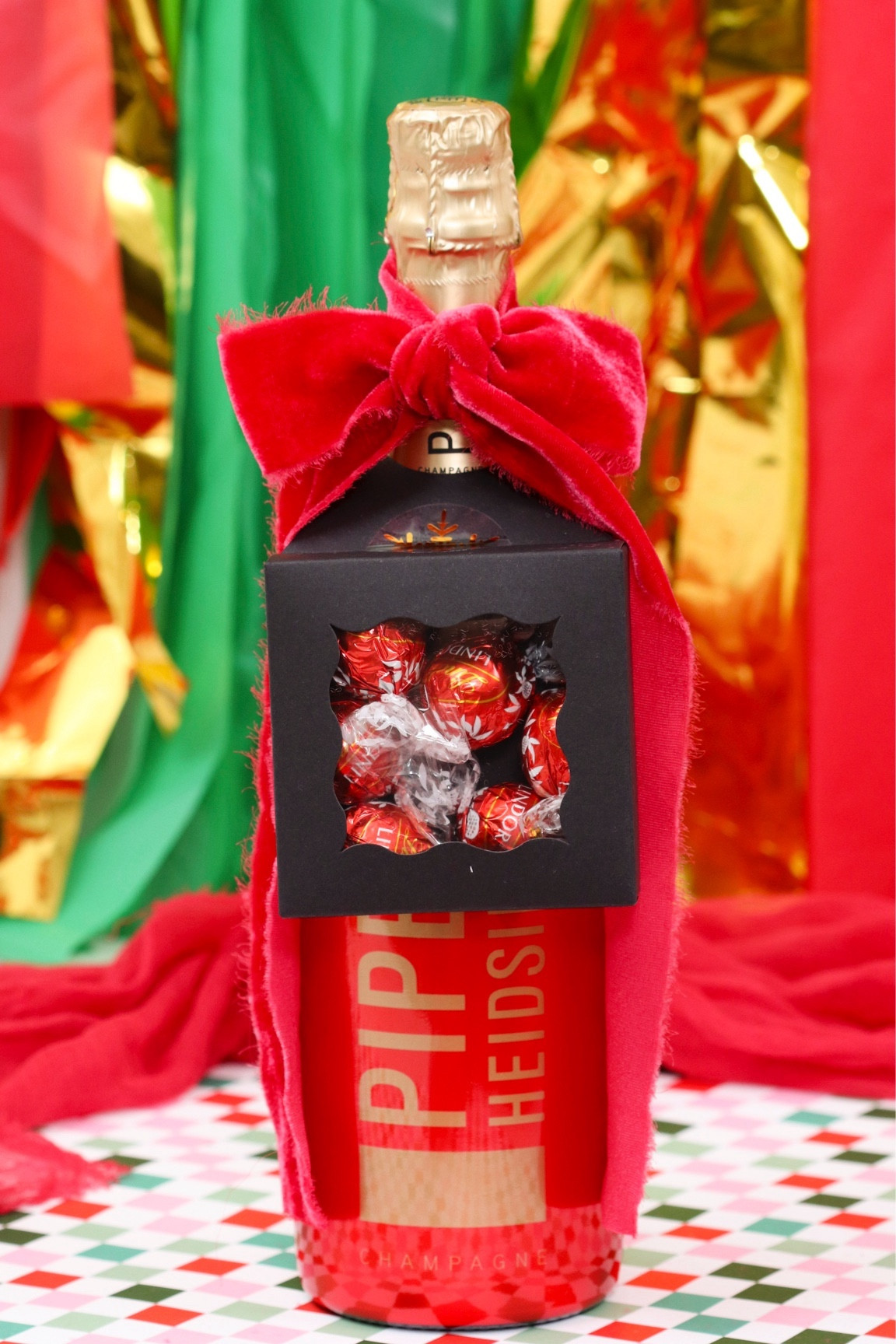 Easy Holiday Hostess  Gift - level up that bottle of wine or bubbles!  🍾🎀
Add these cute little wine gift boxes! I found a set with 3 color options and some holiday seals!
The black one is so pretty against this holiday edition champagne!
I filled this one with chocolates but the options are endless, you could even fill it with a little charcuterie! What would you put inside?! 
🍬🍬🍬

🍬🍬🍬
🍬🍬🍬
#hostessgift #hostessgiftideas #holidayhostessgift#holidaytable #christmastable 

#LTKHoliday #LTKGiftGuide #LTKSeasonal