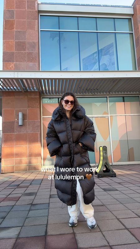 Lululemon down long puffer coat with neutral trousers, Nike sneakers and wundermost bodysuit 
