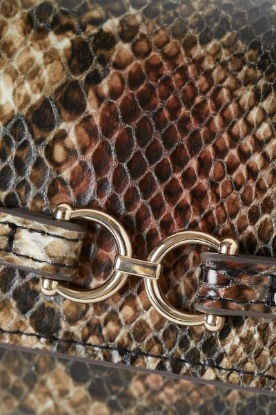 Snakeskin-patterned Clutch Bag | H&M (US + CA)