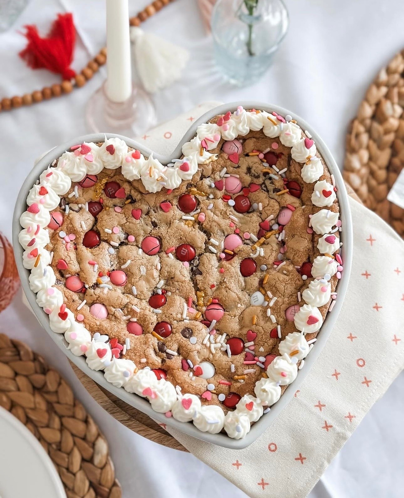 Valentine’s Day is just around the corner, so consider this your sign to plan something sweet (and stress-free). This heart-shaped cookie cake is as easy as it is adorable—made with store-bought dough and all the festive toppings. Perfect for your Valentine, your Galentines, or just because. 💕

#LTKfoodie #LTKHome #LTKSeasonal