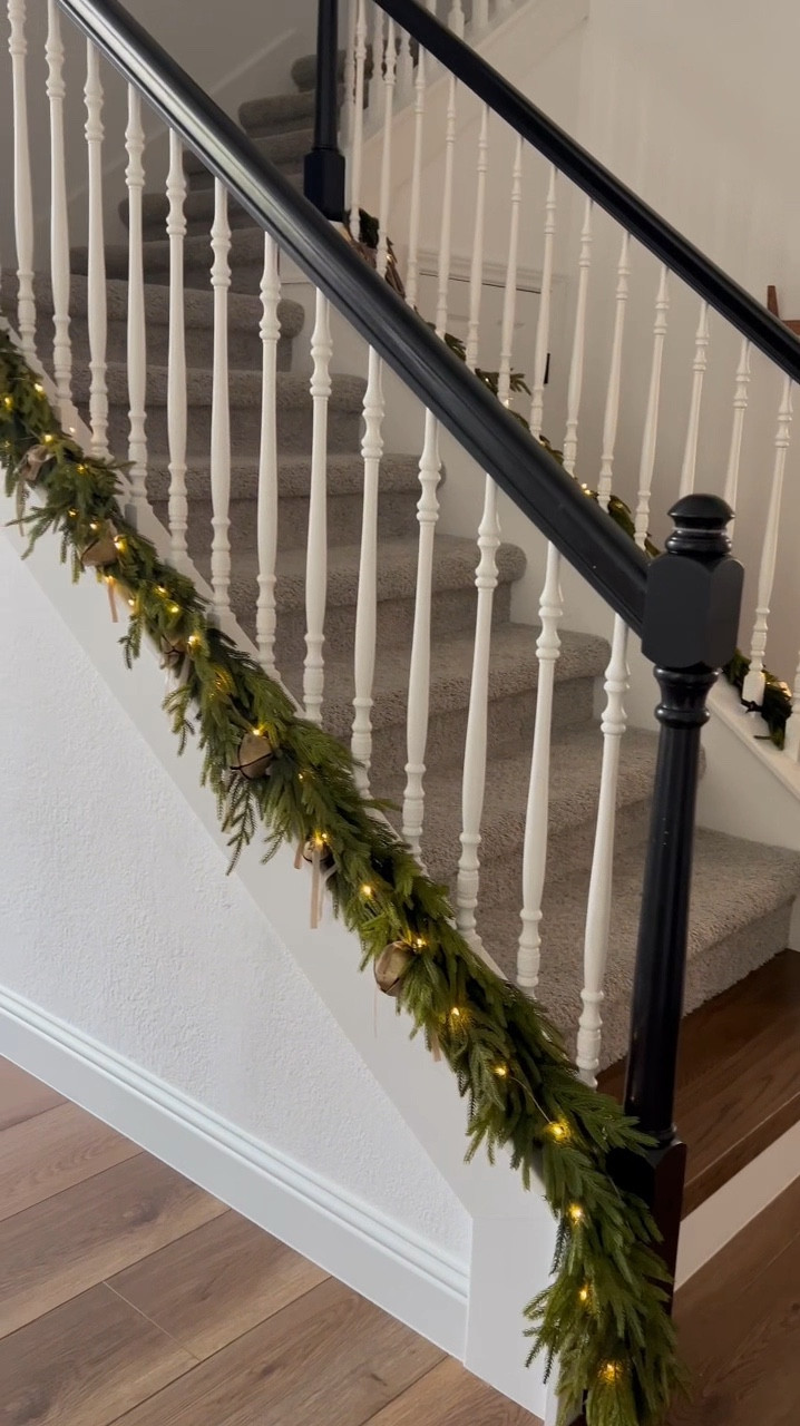 I moved my garland from the handrail to the stringer, and I think I love it! Thoughts?

#LTKSeasonal #LTKHome #LTKHoliday