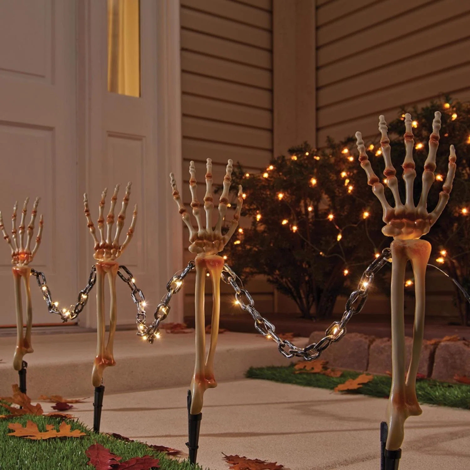 Halloween Warm White 18 in. LED Prelit Chained Skeleton Arms Pathway Decor | Wayfair North America