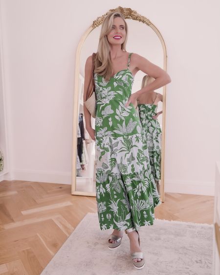 How pretty is this beautiful green Farm Rio midi dress?? It has a sweetheart neckline with molded cups and adjustable straps. If you are very large busted, the top does run on the smaller side so you’ll want to keep that in mind. The straps are fabric bubbles…one of those sweet details this brand is known for. It zips up the back and then has a tiered skirt with contrasting print. It’s more of a maxi length on me at 5’4”, but the fit is true to size. 

This dress would also be wonderful for vacation, the beach, or out to dinner. You can wear a denim jacket over it and wear it with sneakers for a super casual outfit too. The pretty print does all the talking so you can keep your accessories minimal and still make a statement. Fuss-free fashion at its very best!

~Erin xo 

#LTKsalealert #LTKSeasonal #LTKtravel