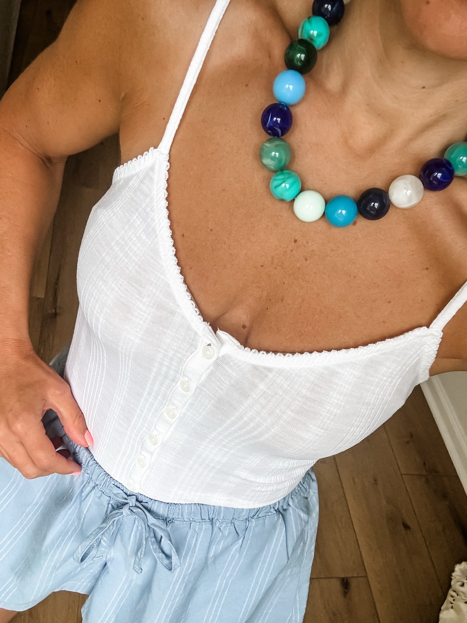 Small white tank top. Beaded necklace.

#LTKOver40 #LTKSaleAlert