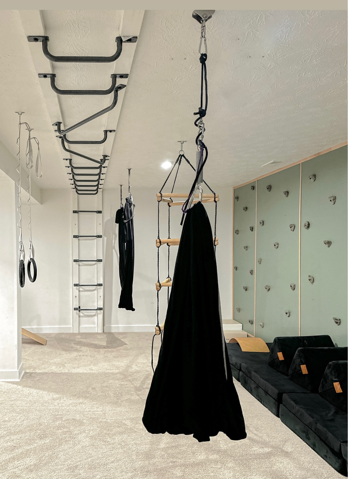 Sensory swing and hardware . We used the hardware that came with the swing but swapped the ceiling attachment for a heavy weight bag hardware and a longer screw. It’s more secure and lets it spin easier! 

#LTKFamily #LTKKids #LTKHome