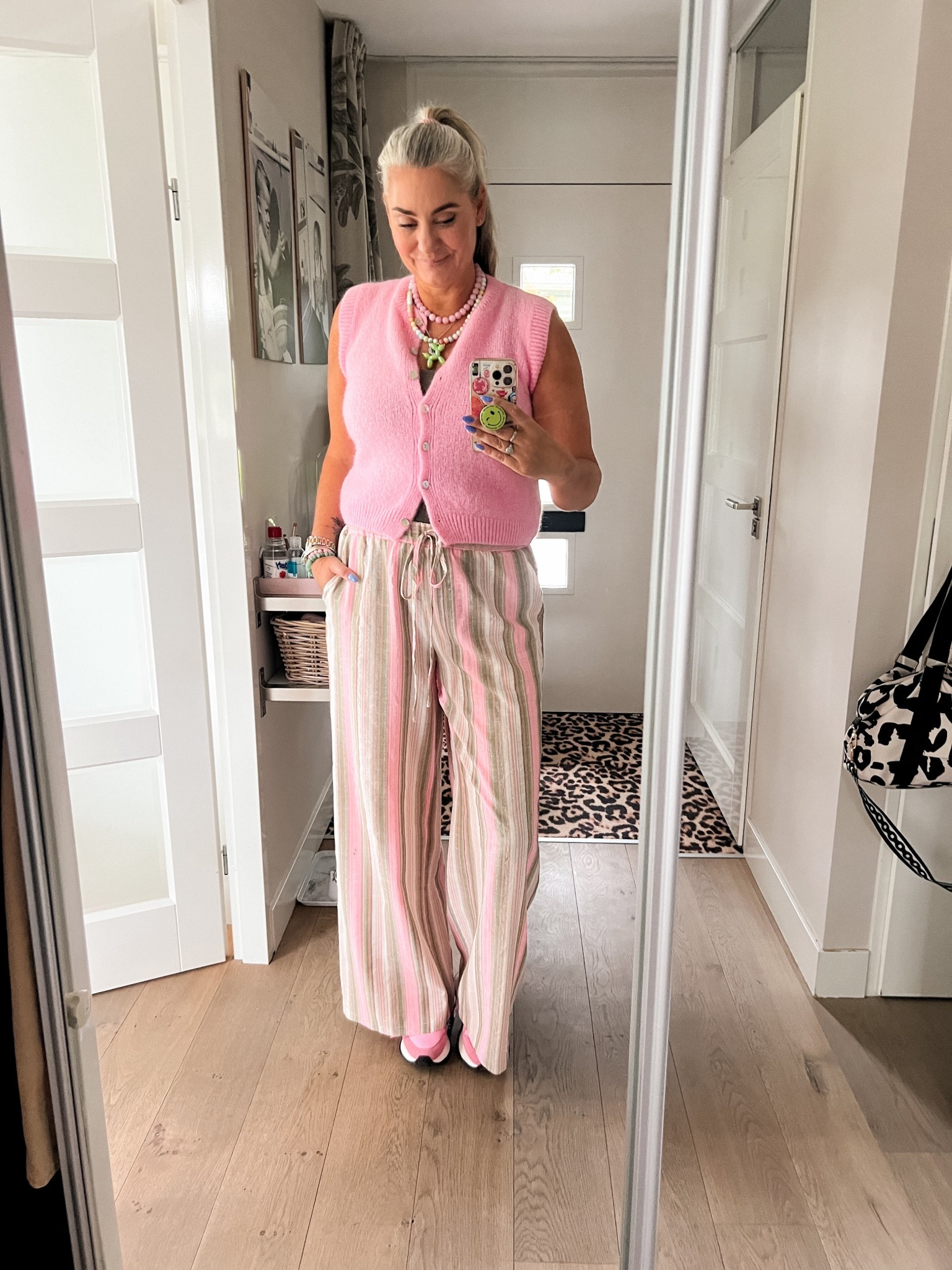 Ootd - Saturday. Tall pink and green striped pants paired with a kaki green tank top and a pink wool sweater that I bought in Knokke. Pink glass bead necklace and multi colored balloon dog necklace. Pink sneakers (Sun68). 



#LTKsummer #LTKeurope #LTKnederlands