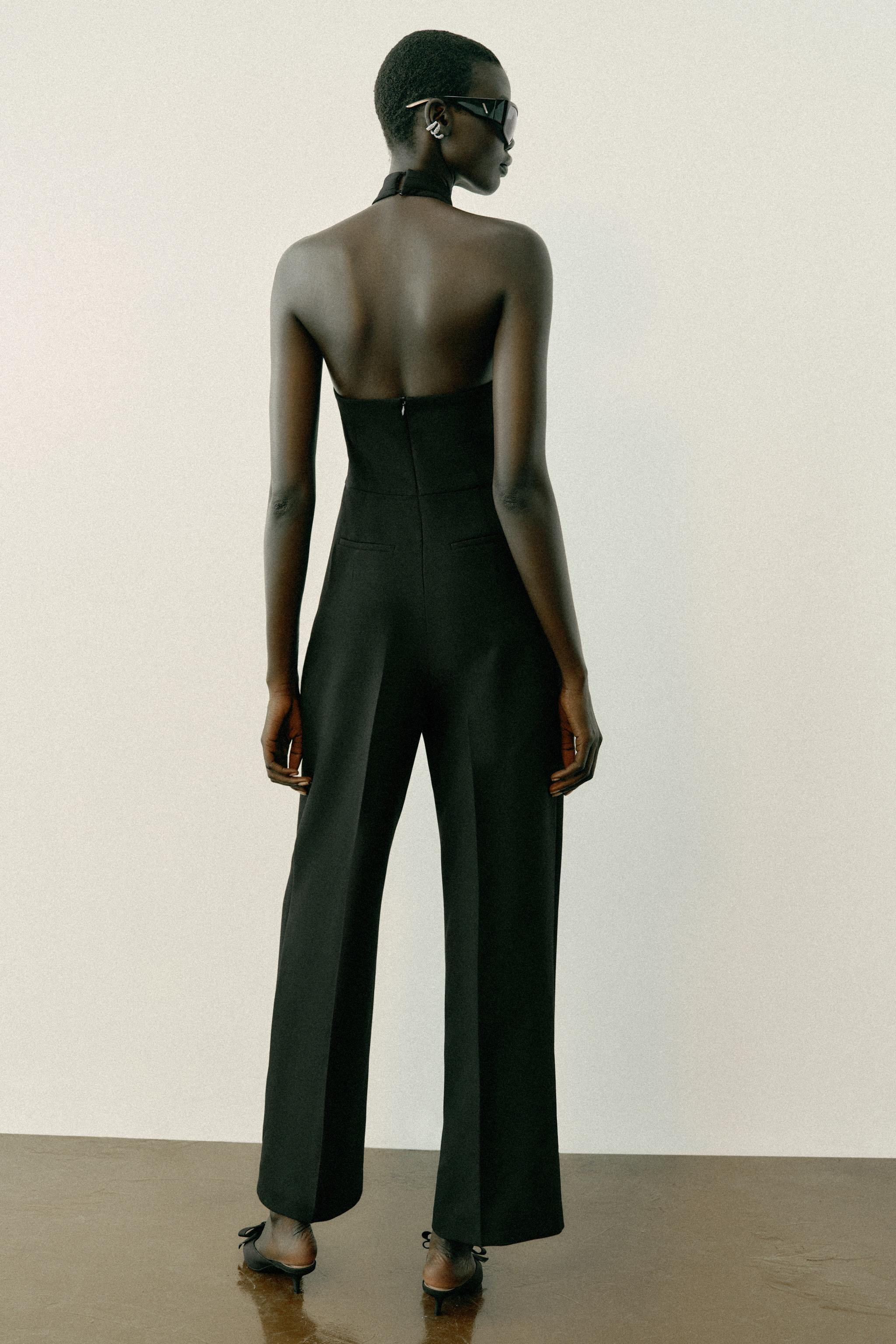Halter-neck jumpsuit with a crisscross design and an open back. Features a crossover front with b... | Zara US