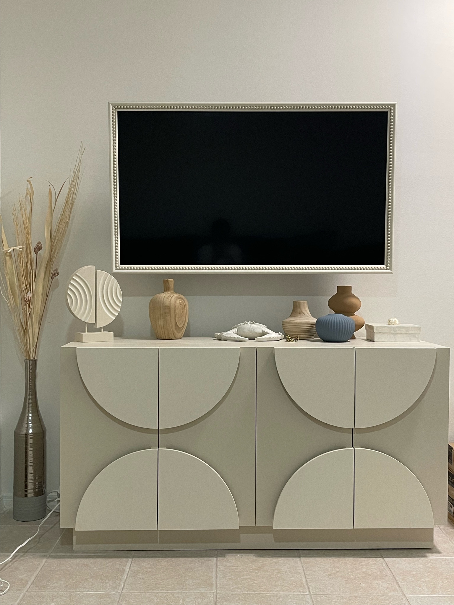 Finished the frame, mounted it with the tv & absolutely loving how this little area of our Florida home turned out!! 
🐚🤍 

#LTKhome #LTKstyletip #LTKxTarget