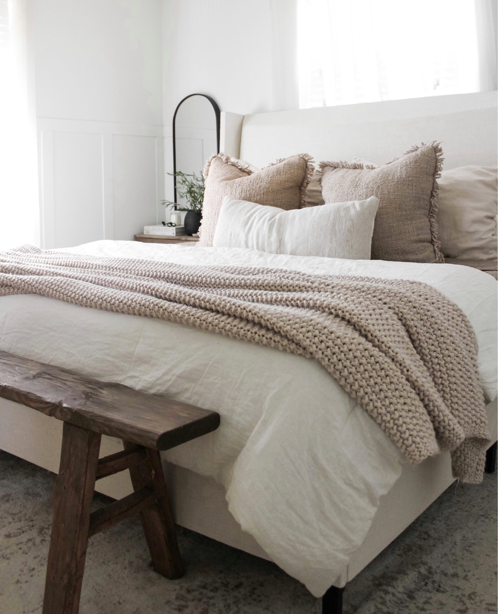 Fall bedroom. Primary bedroom. Linen bedding. Neutral bedroom. White bedding. Knit throw. Arch mirror. Wood nightstand. Wood end table  

#LTKhome #LTKstyletip #LTKSeasonal