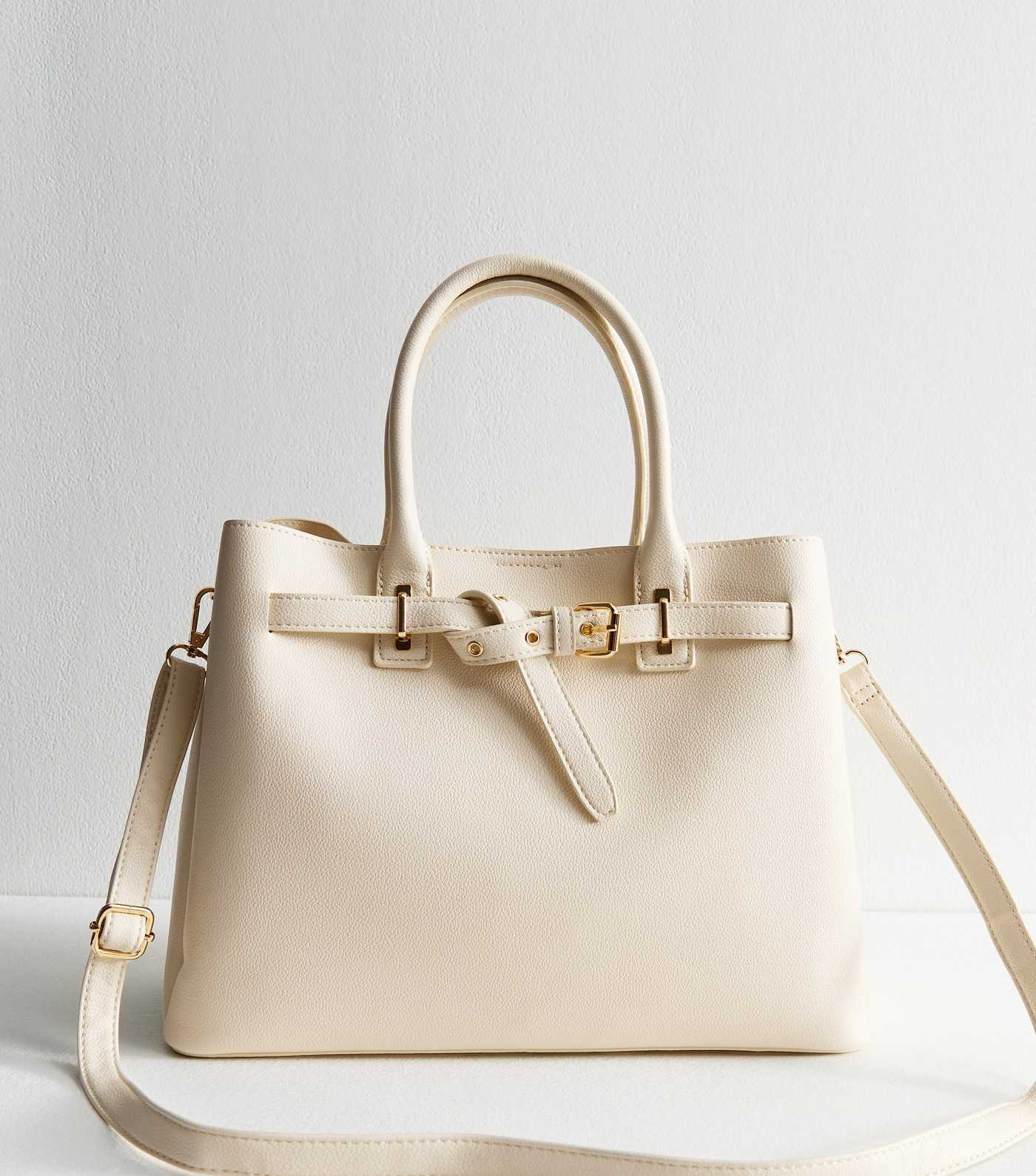 Cream Faux Leather Buckle Strap Triple Compartment Tote Bag
						
						Add to Saved Items
					... | New Look (UK)
