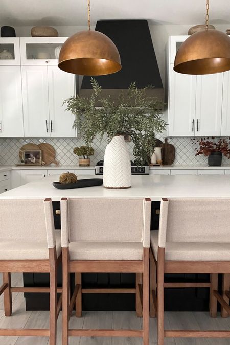 My kitchen has a new look! With affordable wood stools. And copper pendants. 
White kitchen 

#LTKhome
