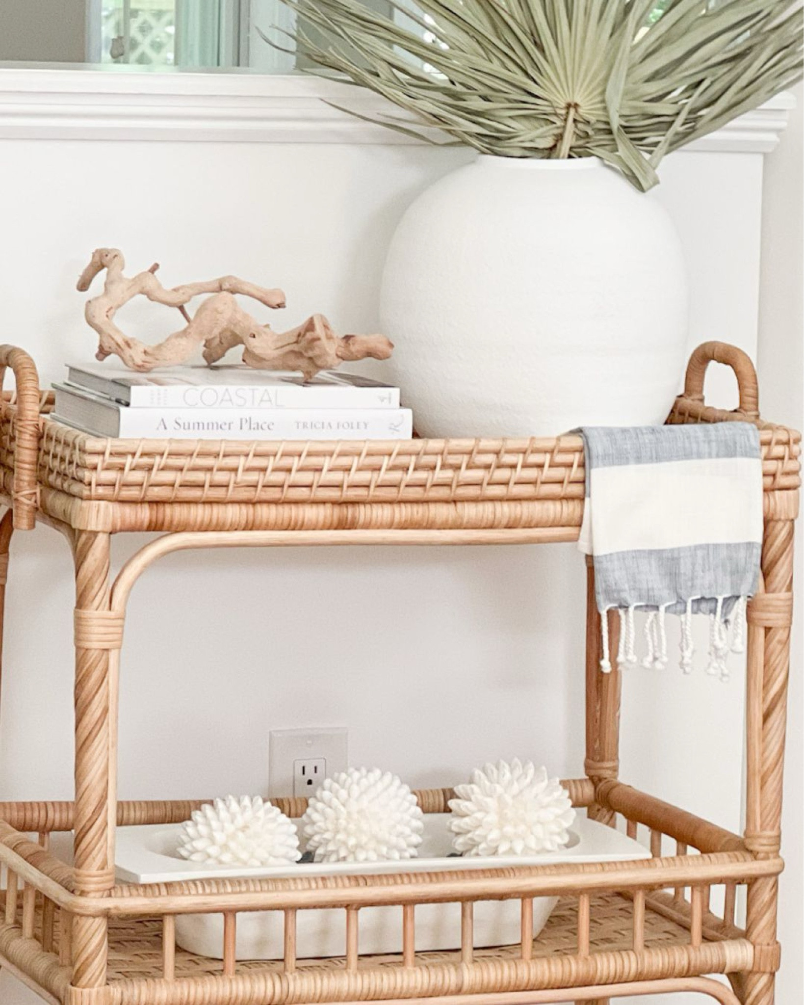 Close-up of my bar cart & some great spring styling accessories! Unable to link the tea towel but it's from Thacher & Spring - also linked some similar ones!
-
spring home decor, spring accessories, coastal home decor, bar cart decor, bar cart styling, amazon coffee table books, coastal coffee table books, white coffee table books, driftwood branch, white vases, large vases, dried palm stems, spring vase filler, spring stems, serena & lily bar cart, south seas side cart, white dough bowl, amazon dough bowl, amazon decorative bowl, spring bowl filler, amazon bowl filler, shell orbs, shell balls, shell decor beach house decor, vacation house decor, summer decor, textured decor, tea towel, rattan bar cart 

#LTKhome #LTKfindsunder100 #LTKfindsunder50