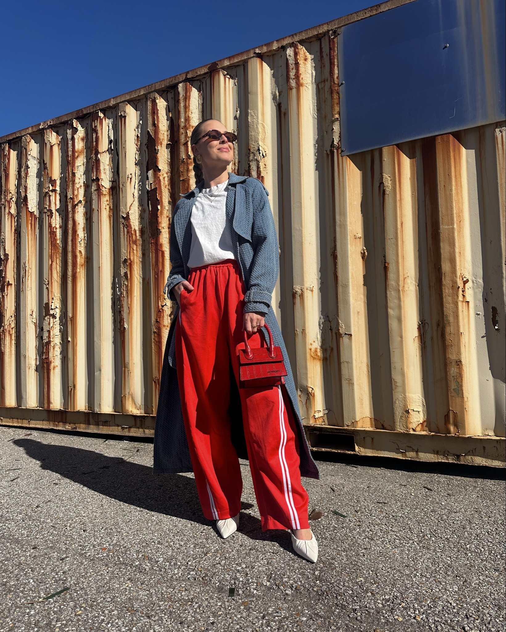 Got a little red going on #redpant #redtrackpant #denimtrench #trench #tibi #redbag #whiteheels #blacksuedestudio #curaee 

#LTKParties #LTKHoliday #LTKStyleTip