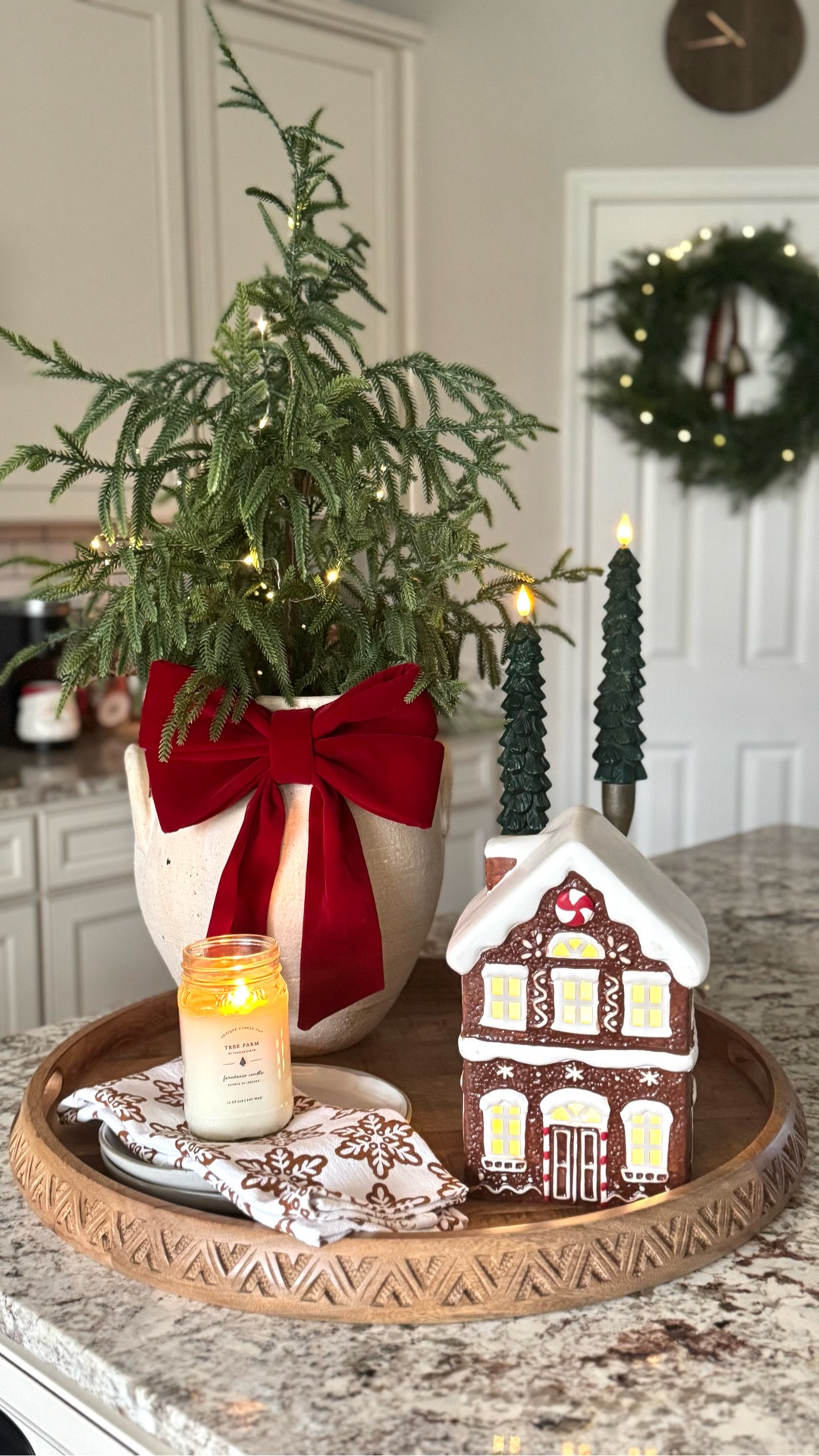 Christmas Centerpiece Decorating Idea 

This beautiful tree is from
Hobby Lobby. Can’t link it but linked other options 

Vase is Arhaus 
Bow, candle holders, plates, napkin and gingerbread house are target 
Tray is world market 
Tree led candles Amazon 

Tree farm candle antique candle co. Code: kristen20 

Christmas Kitchen 
Christmas decorating 
Twinkle lights 
Christmas trees 

#LTKHoliday #LTKHome #LTKSeasonal