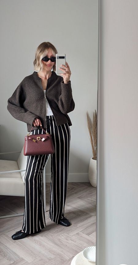 Casual chic outfit spring summer 

• Stripe trousers H&M £14.99 (true to size and would be great for travel or holiday outfits airport outfit )
• Tank top Arket size SCharli London Cardigan size S
• Prada symbole sunglasses
• Arket ballet flats 
• Burgundy red handbag is Parisa Wang (similar linked below)

#LTKfindsunder50 #LTKtravel #LTKeurope
