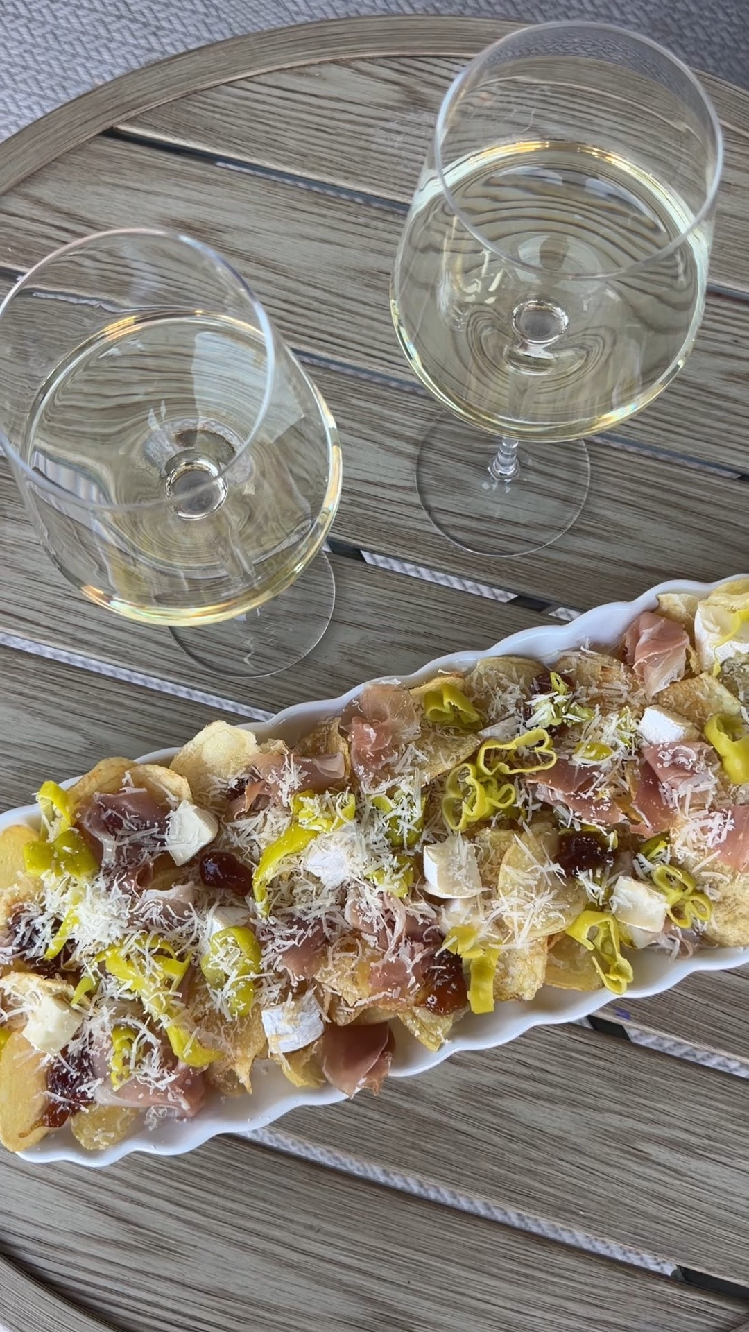 Charcuterie Chips shopping list: 
Salt & vinegar kettle cooked chips
Brie cheese, cut into small cubes
Prosciutto pieces
Fig jam
Sliced pepperoncini
Hot honey
Freshly grated Parmesan

#LTKvlog #LTKfoodie