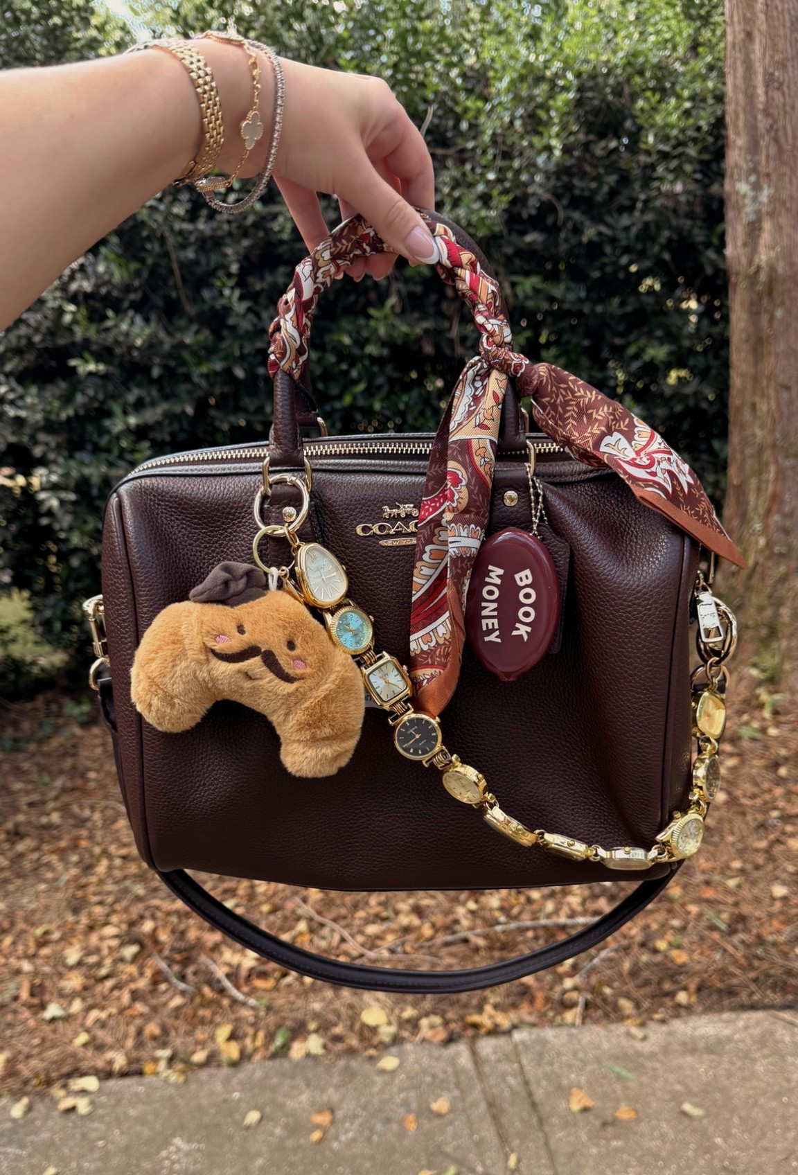 Bag of the day
Coach outlet large Rowan in maple
Watch bag chain from Etsy
Crescent bag charm from mon ami American eagle
Book money coin pouch charm from Amazon