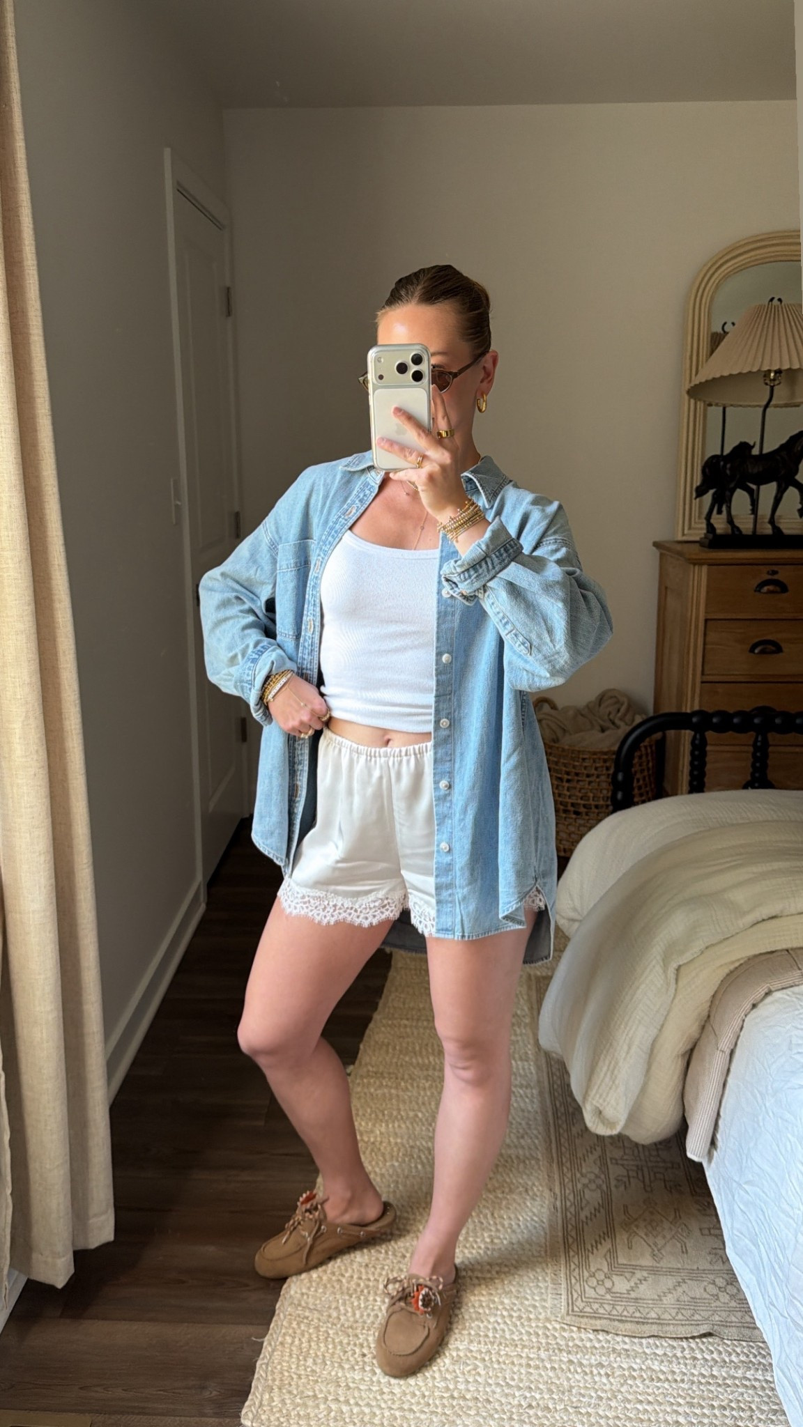 4/15/26 Title:
Casual Spring Outfit with Aritzia Basics


An easy spring outfit built from my favorite Aritzia staples 🤍 The denim shirt is perfectly oversized (wearing a small), and this scoop neck tank is my go-to (wearing an XS). Paired with the satin lace shorts (size small) and finished with these effortless boat shoe mules for a relaxed, everyday look—everything is linked here ✨

#LTKootd #LTKSeasonal