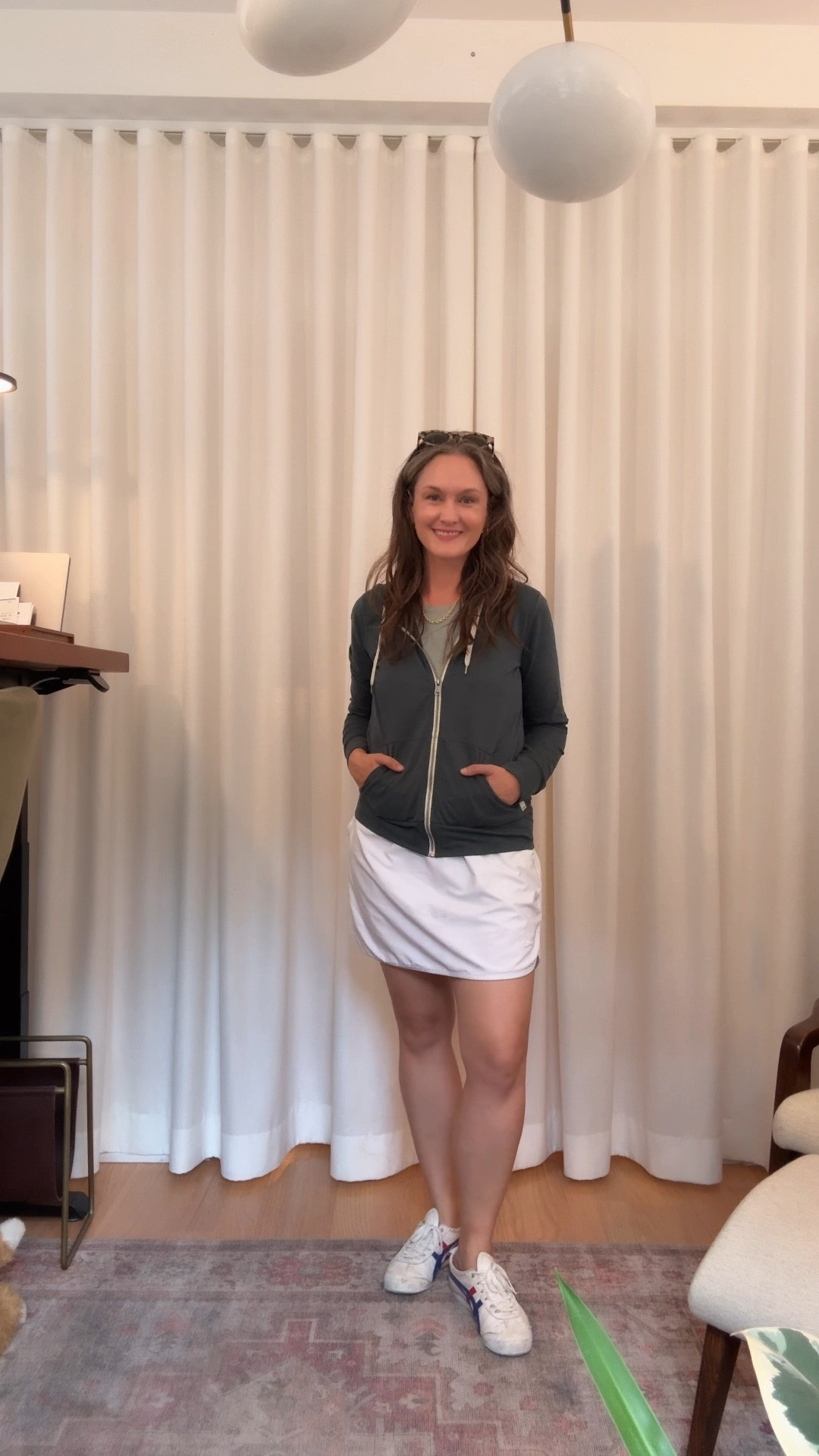 It’s a whirlwind Wednesday in August, and the city mom is perfectly balanced between comfort and style in a white athleisure skirt with a teal tank layered under a dark teal jacket, her favorite sneakers carrying her from task to task, while her go-to gold hoops, graduated rope necklace, and new stack of permanent bracelets add just the right polish. She dives into work at her computer, then slips out for a rejuvenating massage, slides into a virtual meeting feeling effortlessly pulled together, and finally heads to physical therapy—where she finally gets answers to her lingering ankle issues, all without ever having to change out of the outfit that’s carried her gracefully from one appointment to the next.

#LTKFamily #LTKStyleTip #LTKActive