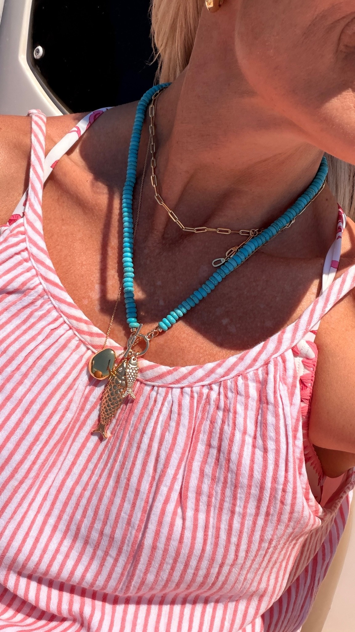 Loving playing with more colorful jewelry lately. Especially on a tropical vacation. This turquoise necklace is so darn cute. Love the fish pendant and the color of turquoise. Not a piece of jewelry that would last forever but wonderful for a season or two and very affordable! 
Love paired with the pop of orange in this dress ￼

The Amazon necklaces, I wouldn’t wear in the water, but my other necklaces I wear in the ocean, the pool the shower.  They do not tarnish

#LTKootd #LTKSwim #LTKTravel