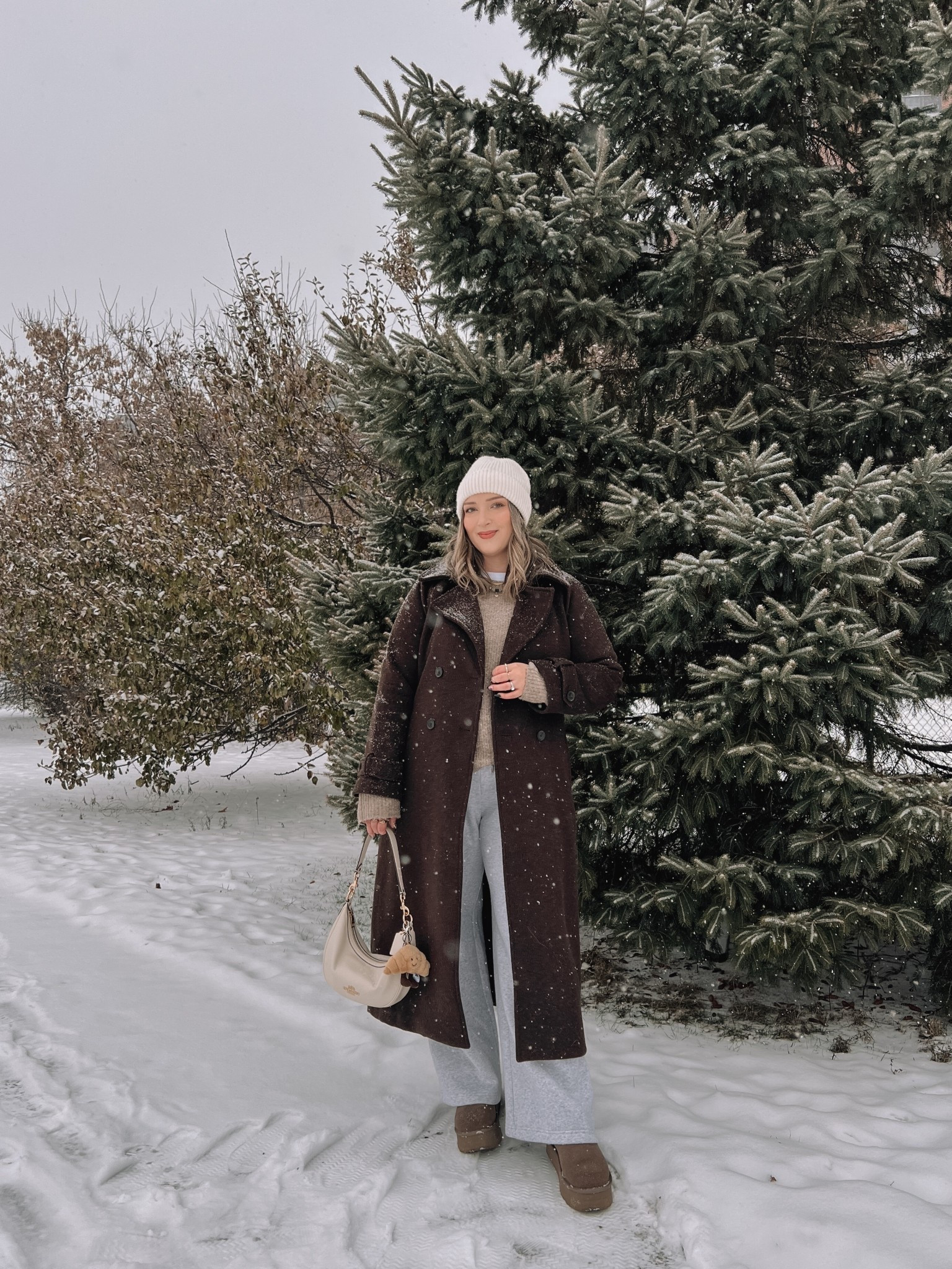 Today’s winter outfit! Wearing my usual size L in the chocolate brown wool trench coat - it’s so warm and such a good staple piece! Also wearing L in the wide leg sweatpants, these are thick and cozy and cute enough to wear out! This white tee is my fave for layering since the neck is higher, wearing my usual size L. My Ugg style boots are Amazon and such good quality! I’m usually a 9.5-10 and wear a 10 in these. Linked similar neutral sweaters & cream beaniee


#LTKmidsize #LTKwinter #LTKstyletip