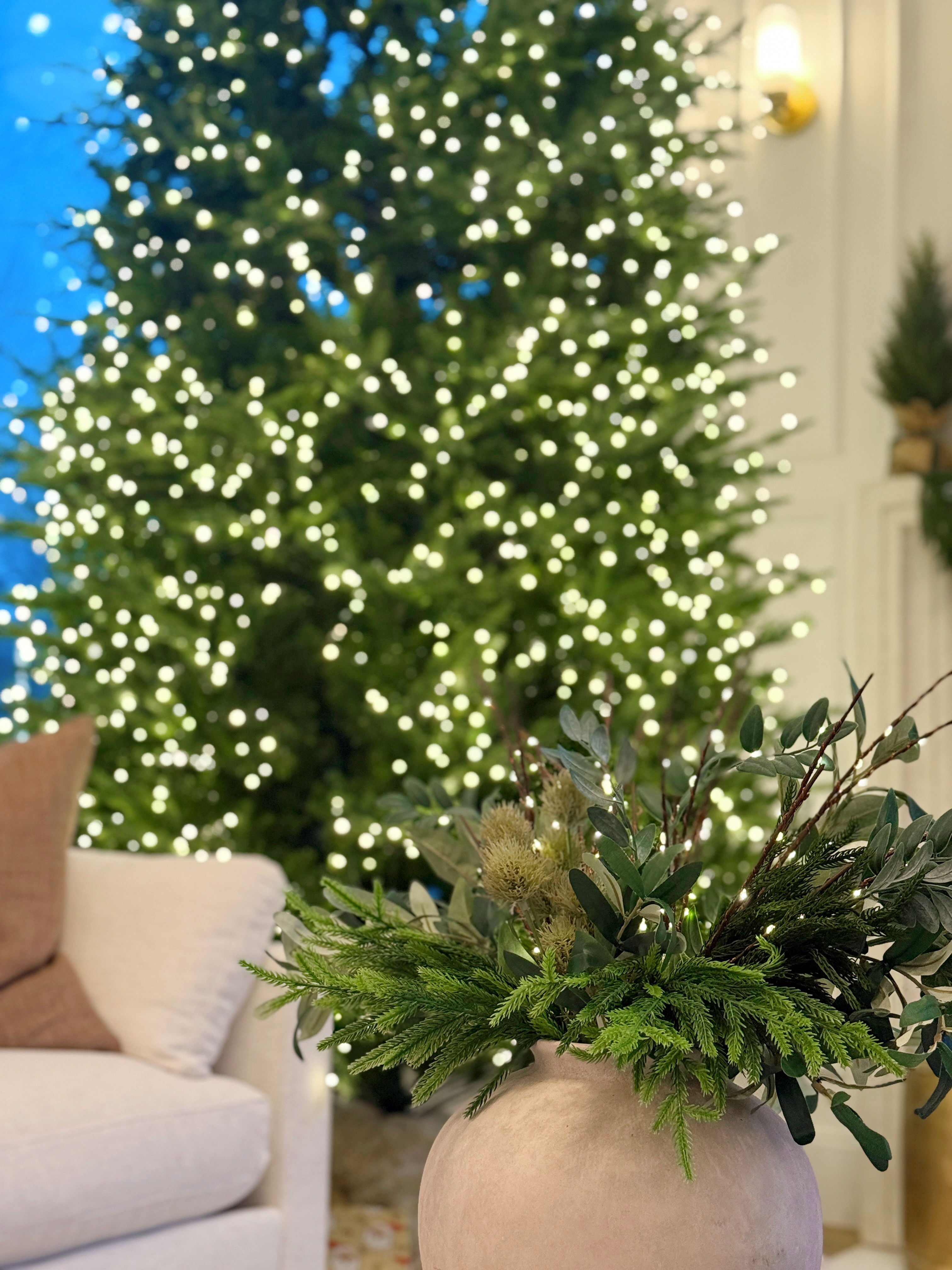 Prelit faux Christmas tree and faux Christmas plant #holidaydecor #holiday #Christmas #fauxgreenery 

 #LTKHoliday #LTKSeasonal #LTKHome