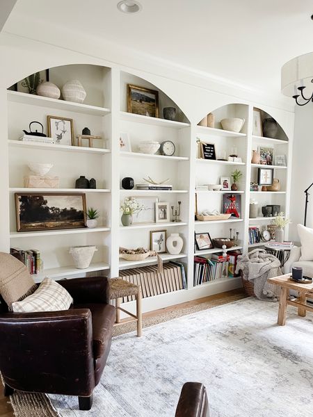 Our sitting room is one of favorites and adding these arches is just what these built ins needed! Great place to display books, home decor pieces and more!

#LTKFind #LTKstyletip #LTKhome