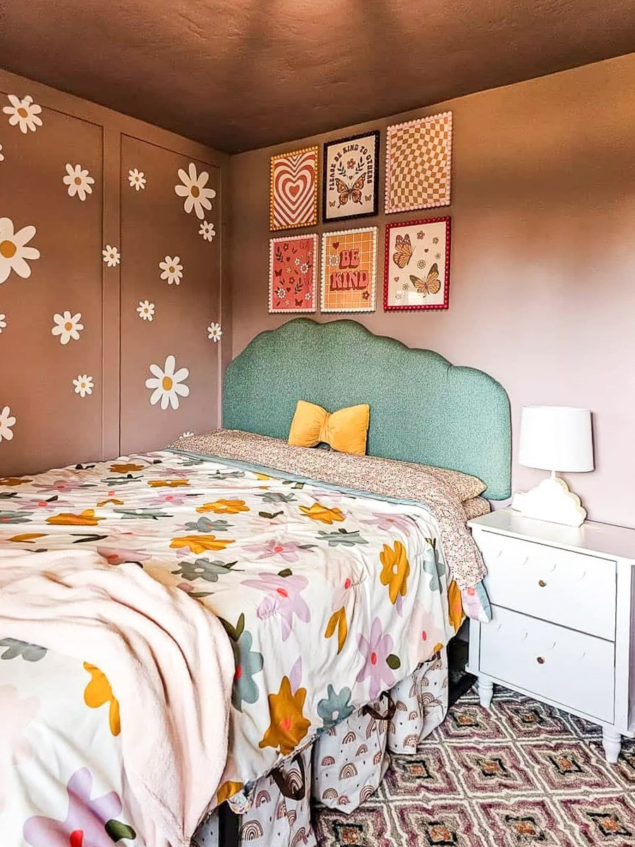 This little girl's room is pure joy, with pink walls, a flower wall, and a blue-green cloud headboard that somehow all work together perfectly. Retro art and floral bedding bring in even more color, making it a space she's going to love growing into. #girlsbedroom #kidsroomdecor 

 #LTKmomlife #LTKHome #LTKKids