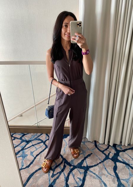 Jumpsuit. Dinner outfit. Nice athleisure material. Size down if in between. In Petite length at about 5’4. Nice athleisure material. Can cinch the pant legs to make them joggers style. 
Slide sandals. 
Denim bag. 
Code HINTOFGLAM to save on bracelets and necklace  

#LTKshoecrush #LTKover40 #LTKitbag