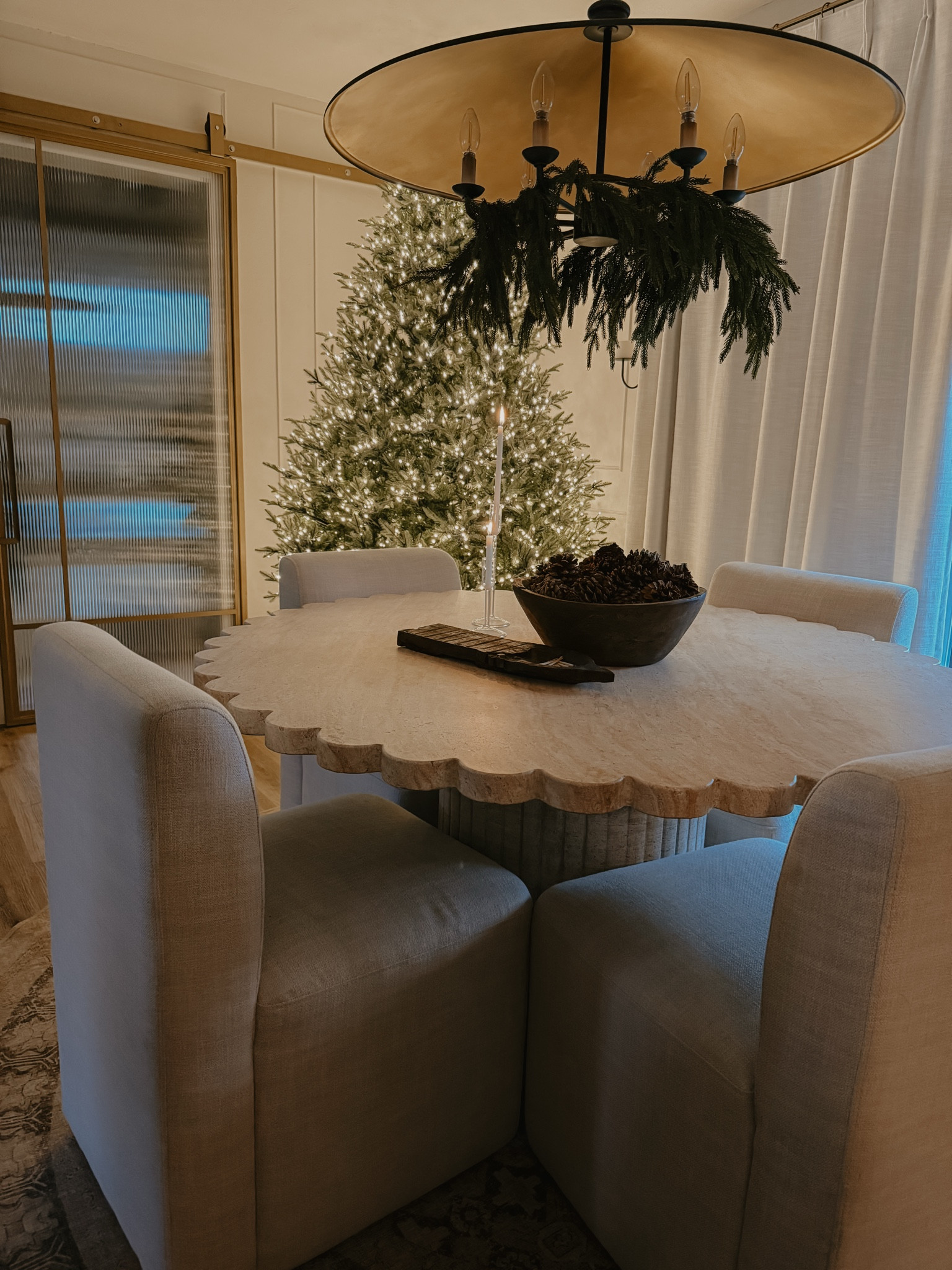 Holiday winter Christmas dining room 

Unique scalloped stone dining table 
Tablescape simple 

#LTKSeasonal #LTKWatchNow #LTKHoliday