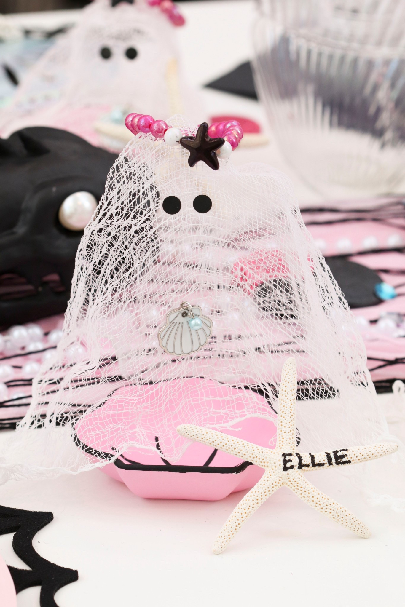 From under the sea to spooky season… meet my Mer-Ghost! 🧜‍♀️👻💀
I’ve made cheesecloth ghosts for past Halloween themes (remember my cowgirl ghost? 🤠👻), but this year she’s going coastal creepy.
With a shell necklace, a blackened mermaid crown, and a starfish place card, she’s ready to haunt the table in style. 🐚✨
This mermaid ghost place card DIY is another sneak peek into the full Halloween party theme I’ll be revealing soon 👀🎃
👉 SAVE this for your own spooky table &
Follow for the full theme — it’s a party you don’t want to miss. 🖤

#LTKHome #LTKParties #LTKSeasonal