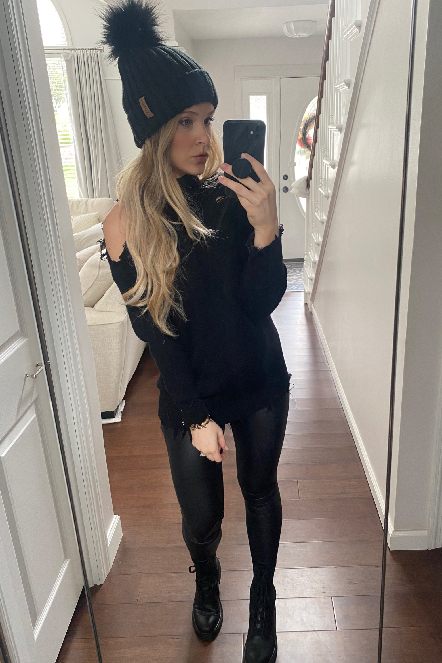 All black fall outfit with faux leather leggings // beanie // cutout sweater // combat boots