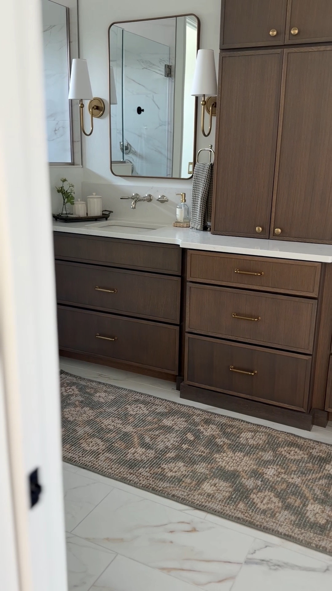 Updated our bathroom with this stunning vintage style runner from @Quince! This is the Lena Hand-Knotted Wool Rug in the 2’6” x 8’ runner size. I love the olive green colors and vintage style pattern. Soft underfoot so perfect for a bathroom, kitchen, hallway, etc. #quincepartner