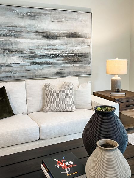 Styling for a family room. We love how the artwork pulls from the decor and furniture. 

#LTKhome #LTKstyletip