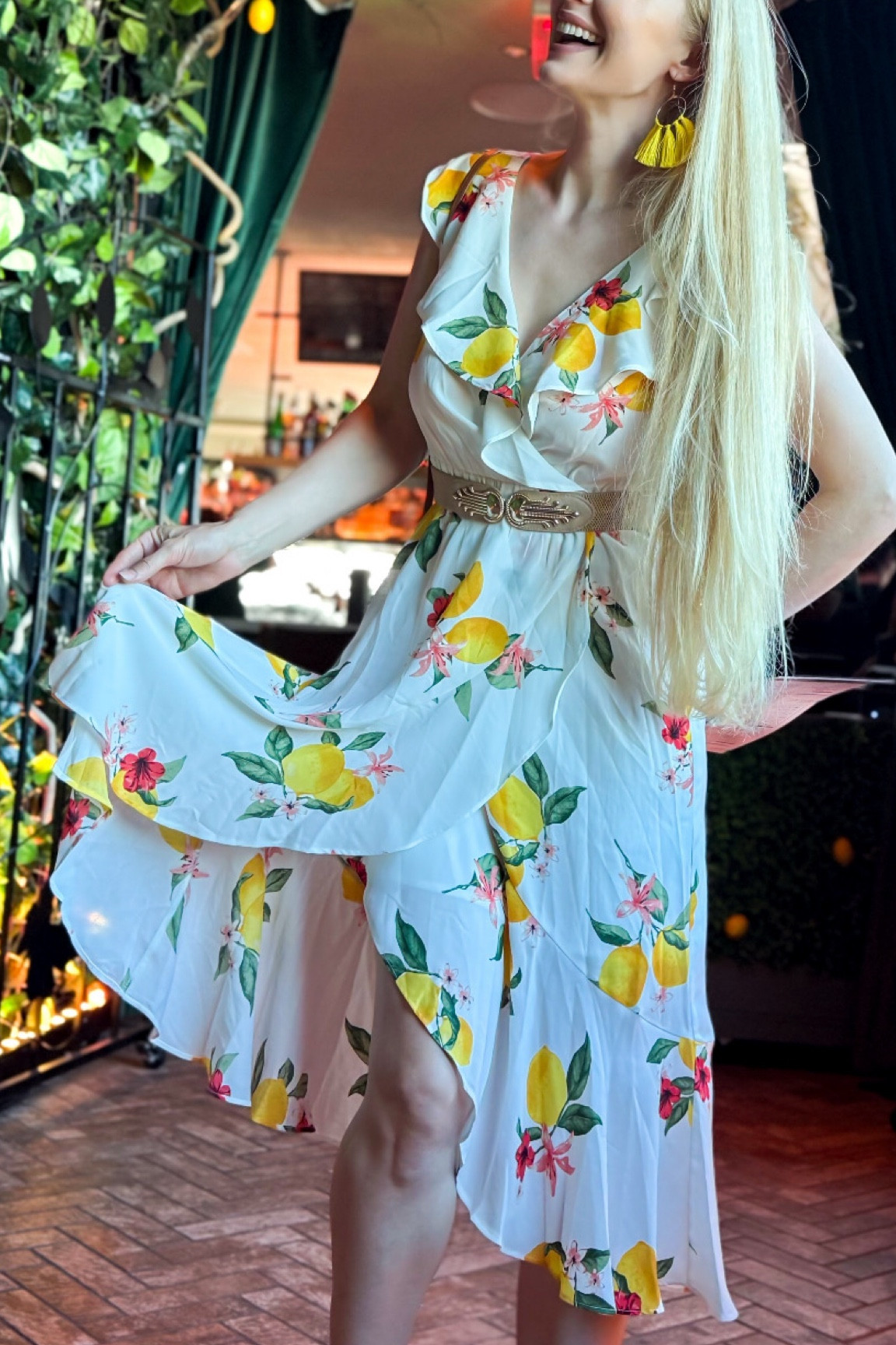 White dress with lemon accents. Flowy and covers the shoulder. Couldn’t find the exact one, but here are similar styles 

#LTKParties #LTKSeasonal #LTKWedding