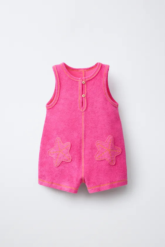 Round neck towelling playsuit with sleeveless design. Featuring tear-drop button fastening and st... | Zara UK