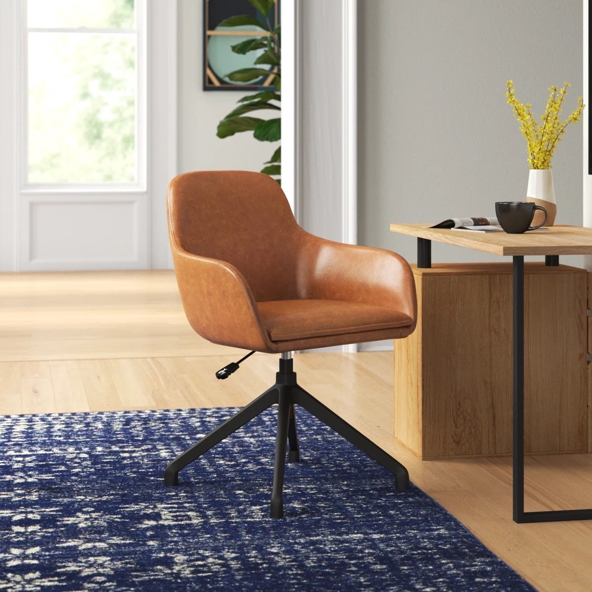 Work in style and comfort 🤎
This mid-century swivel desk chair adds warmth to any home office — faux leather, adjustable height, and a sleek black base for that modern touch.

#homeoffice

#LTKHome