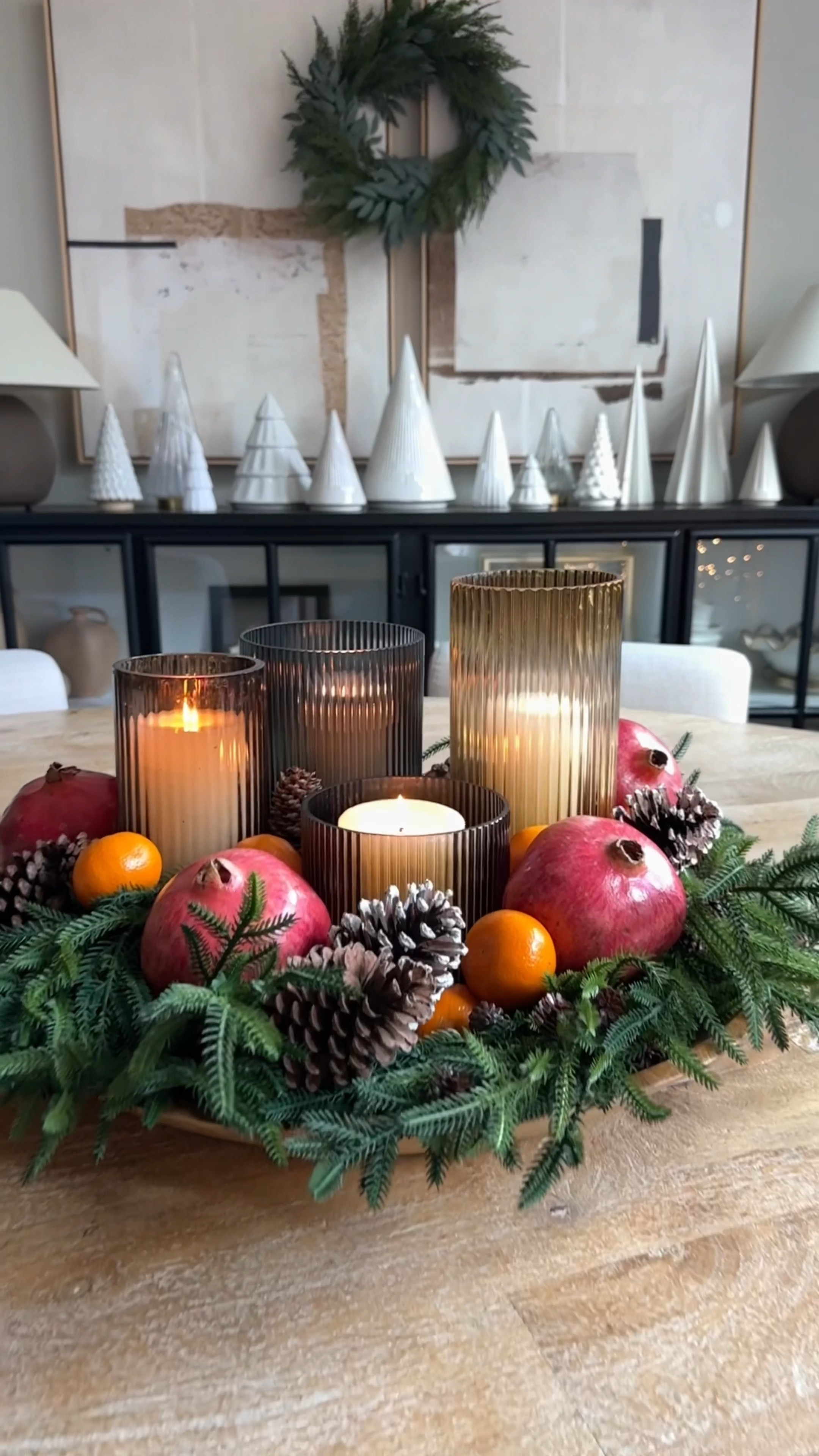 Thanksgiving / Christmas tablescape. I wanted to create an earthy, organic tablescape that welcomes the season with warmth and elegance. I started with faux pine stems to bring that lush, evergreen touch without worrying about wilting. Then, ladded fresh pomegranates and tangerines for a pop of festive color and natural beauty-perfect for that rustic, organic vibe.
And of course, no holiday table is complete without candles.
And just like that, your tablescape is complete! It's simple, sophisticated, and sure to be the perfect backdrop for your holiday celebrations.

#LTKVideo #LTKHome #LTKHoliday