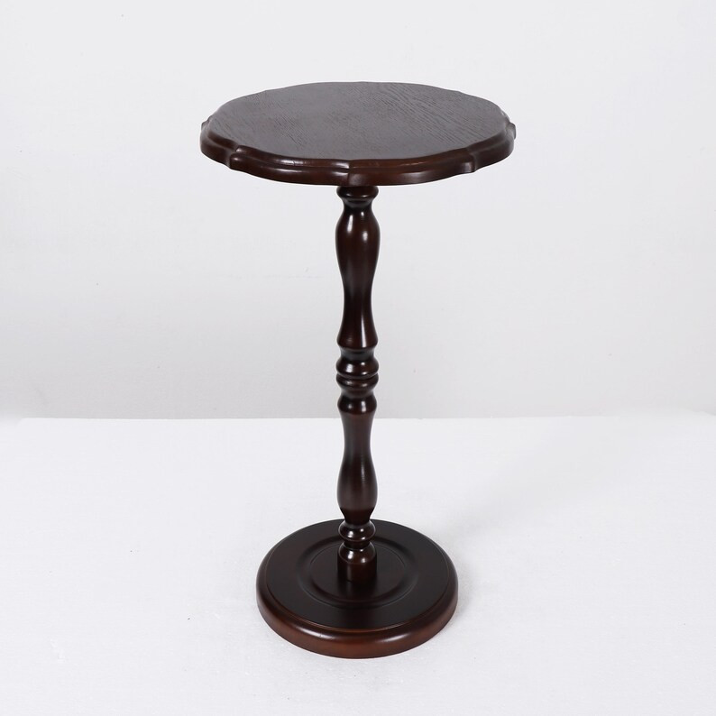 This tall round pedestal side table adds elegance and versatility to any corner of the home. With... | Etsy (US)
