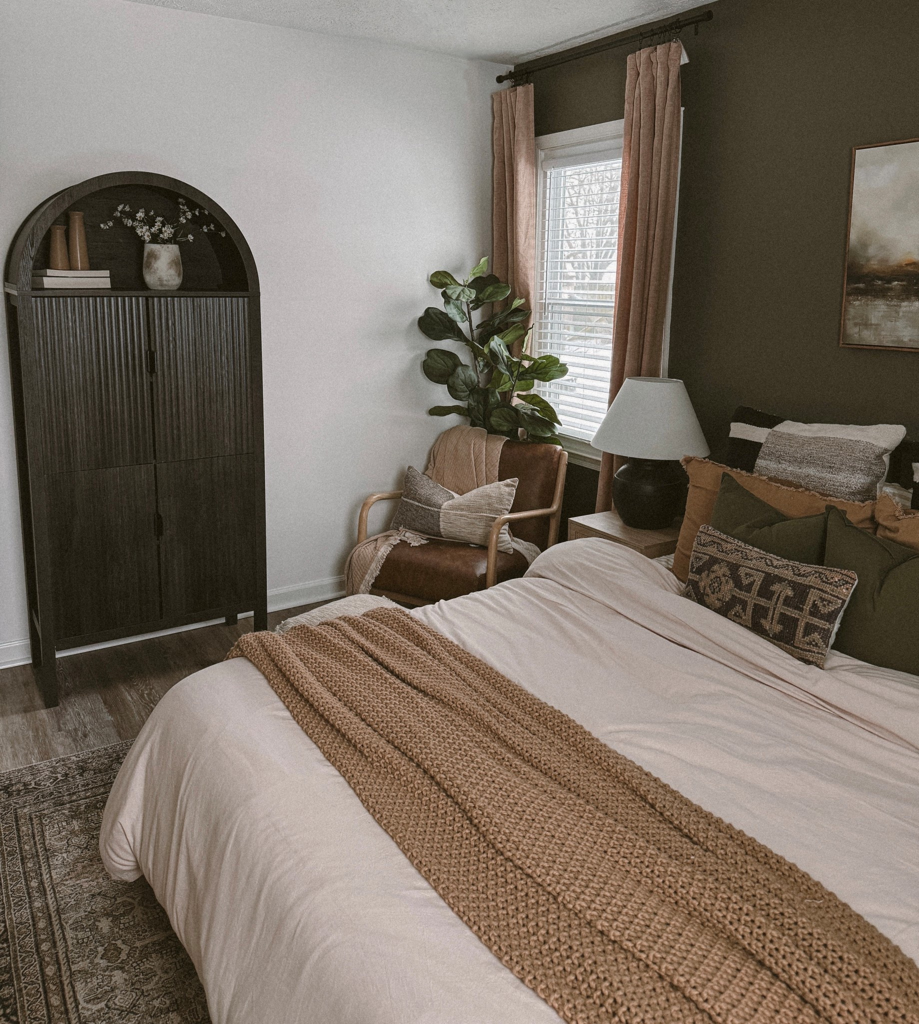 Guest bedroom decor, arched cabinet, greens, browns, Loloi rug, green pant, organic bedroom, bedroom styling, plants, target decor, target bedroom 

#LTKHome